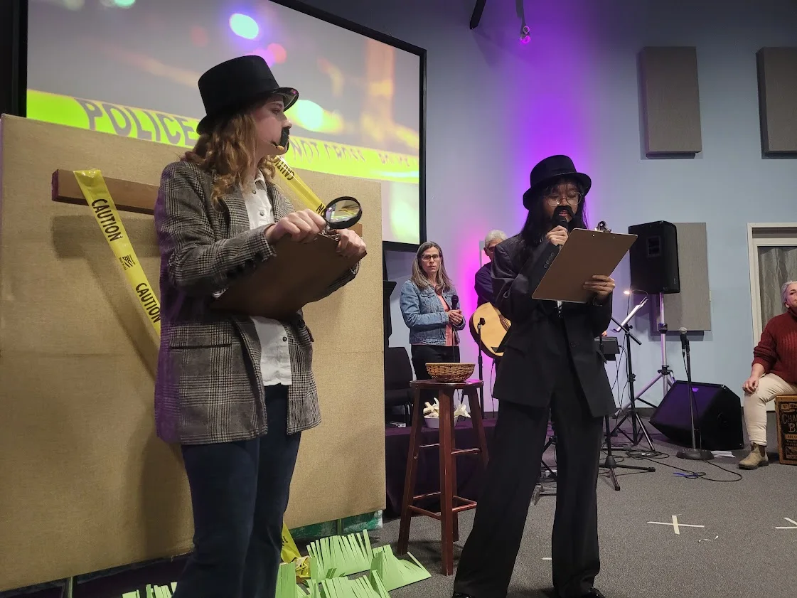 Two youth, dressed as detectives, for an Easter play