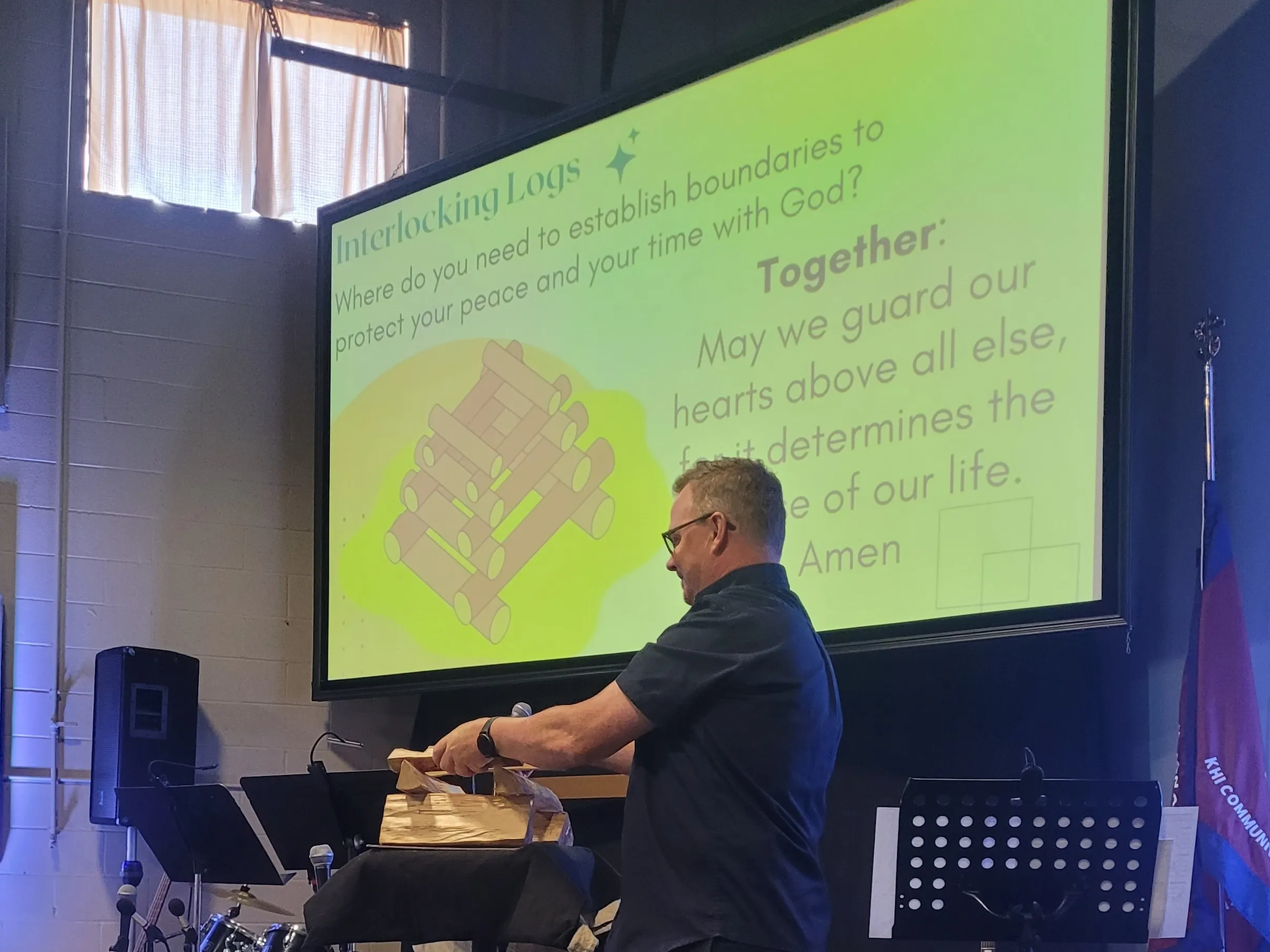 Captain Peter Hickman builds a campfire as an illustration during prayer time